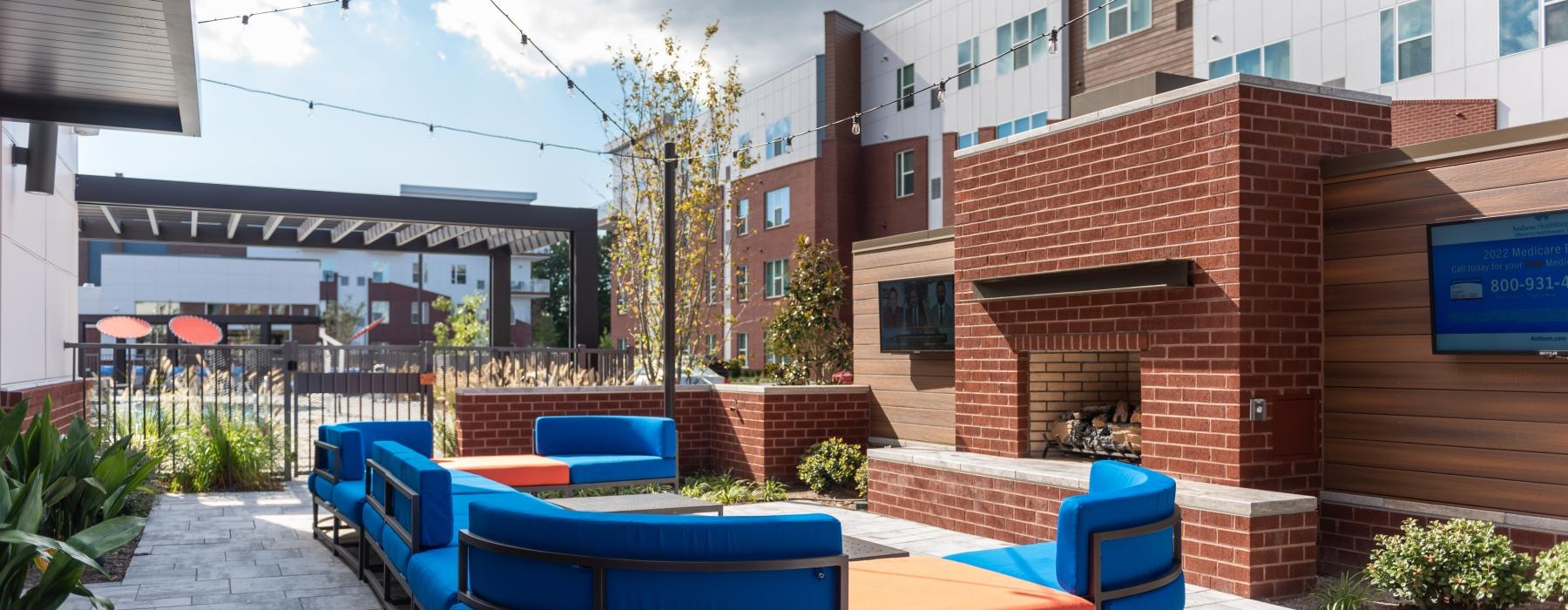 a group of blue chairs outside a building