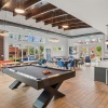 clubroom with coffee bar, pool table, and lounge seating