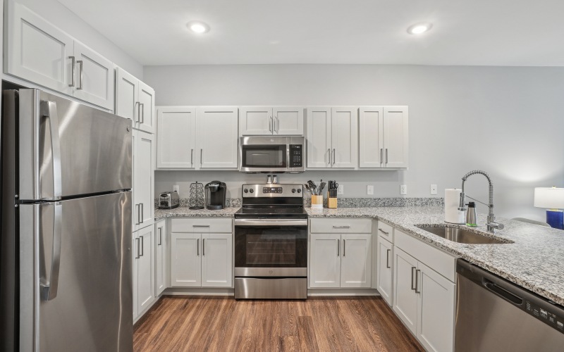 kitchen with white cabinetry and stainless steel appliances