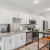 white cabinetry and stainless steel appliances